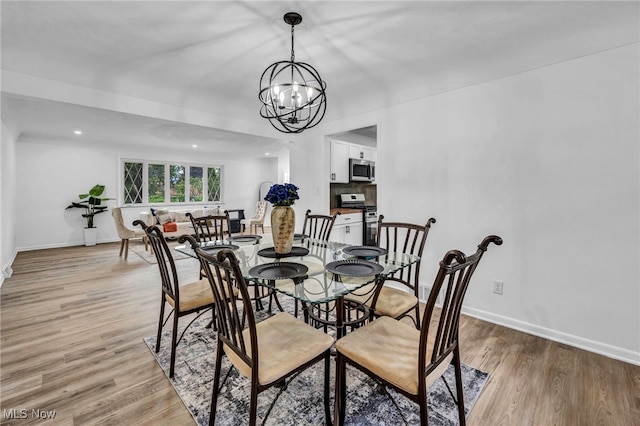 2162 Daniels Ave, Akron, OH 44312 - dining space featuring a chandelier, light wood finished floors, and recessed lighting