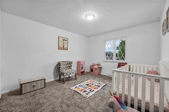 2162 Daniels Ave, Akron, OH 44312 - carpeted bedroom with baseboards and a nursery area