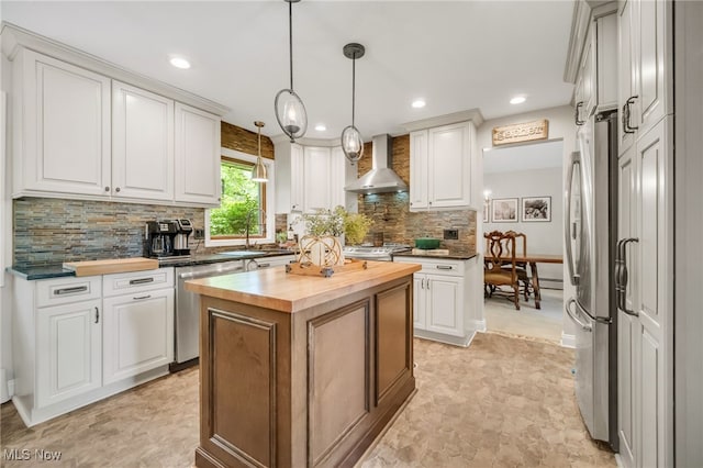 5108 Great Oaks Pkwy, Independence, OH 44131 - kitchen featuring wall chimney range hood, appliances with stainless steel finishes, wooden counters, a center island, and decorative backsplash