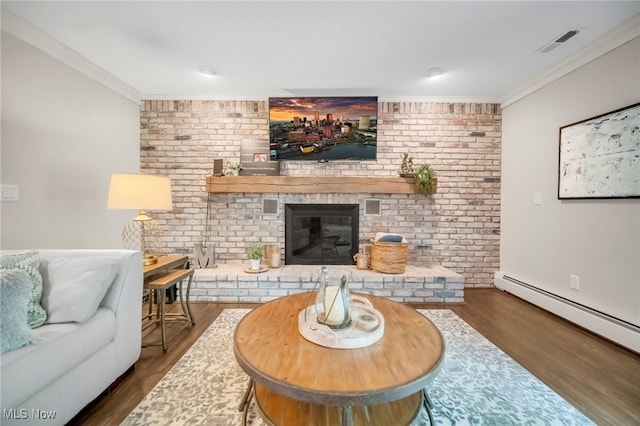 5108 Great Oaks Pkwy, Independence, OH 44131 - living room featuring wood finished floors, crown molding, brick wall, a fireplace, and a baseboard radiator