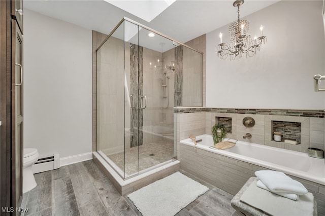 5108 Great Oaks Pkwy, Independence, OH 44131 - bathroom featuring a baseboard heating unit, a bath, a stall shower, and wood finished floors