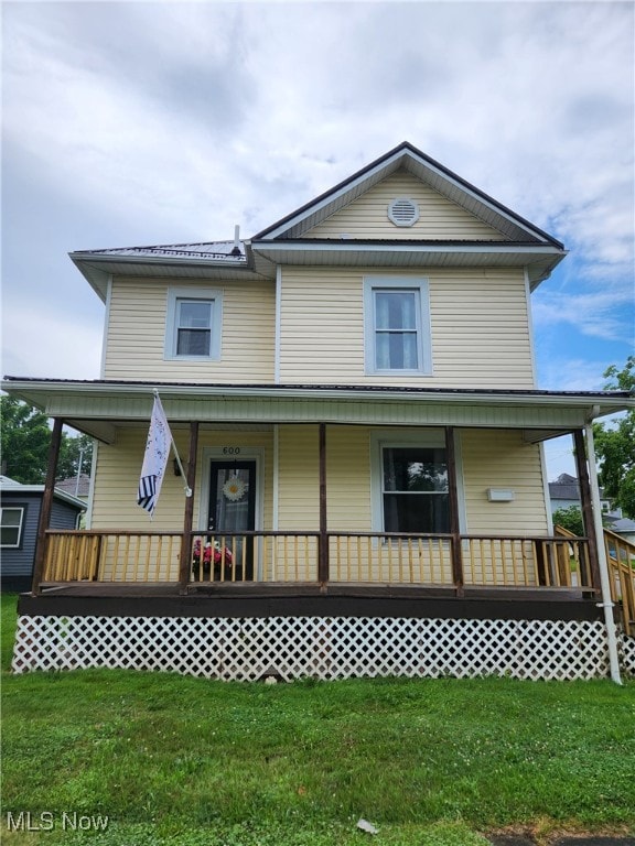 600 Orchard Ave, Cambridge, OH 43725 - view of front facade with covered porch and a front lawn