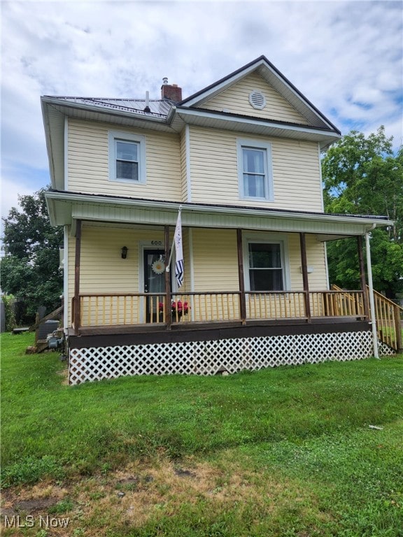 600 Orchard Ave, Cambridge, OH 43725 - view of front of property featuring covered porch, a front yard, and a chimney