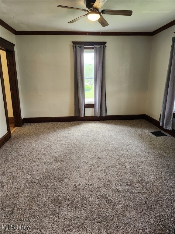 600 Orchard Ave, Cambridge, OH 43725 - unfurnished room with carpet, ceiling fan, and ornamental molding