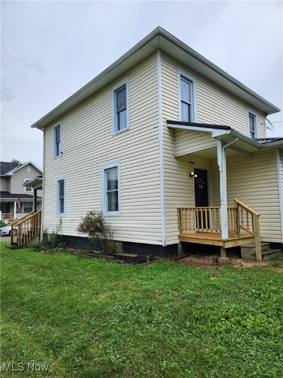 600 Orchard Ave, Cambridge, OH 43725 - back of house featuring a lawn