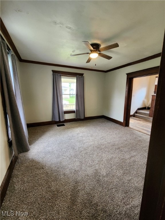 600 Orchard Ave, Cambridge, OH 43725 - carpeted spare room featuring ornamental molding and ceiling fan