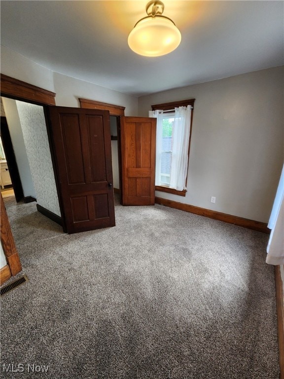 600 Orchard Ave, Cambridge, OH 43725 - unfurnished bedroom with baseboards and carpet