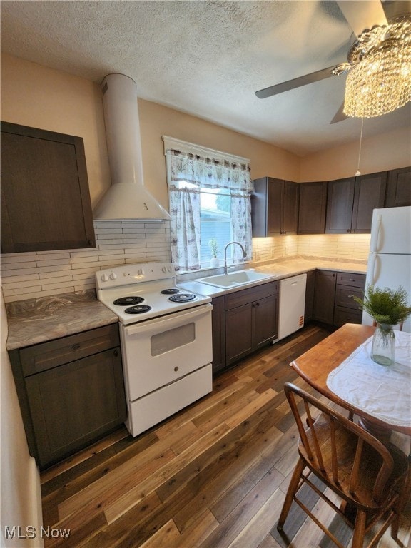 600 Orchard Ave, Cambridge, OH 43725 - kitchen featuring white appliances, wall chimney exhaust hood, dark wood-type flooring, ceiling fan, and backsplash