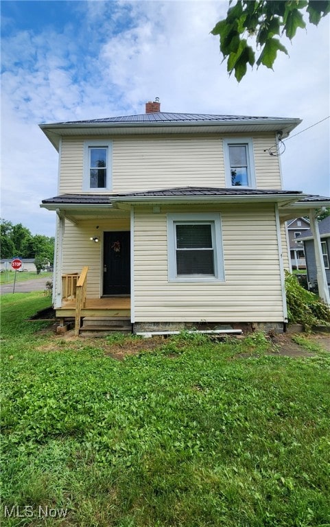 600 Orchard Ave, Cambridge, OH 43725 - rear view of property featuring a lawn and a chimney