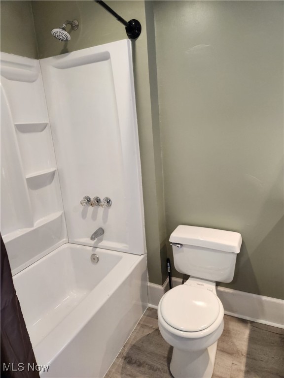 600 Orchard Ave, Cambridge, OH 43725 - full bathroom featuring wood finished floors and tub / shower combination