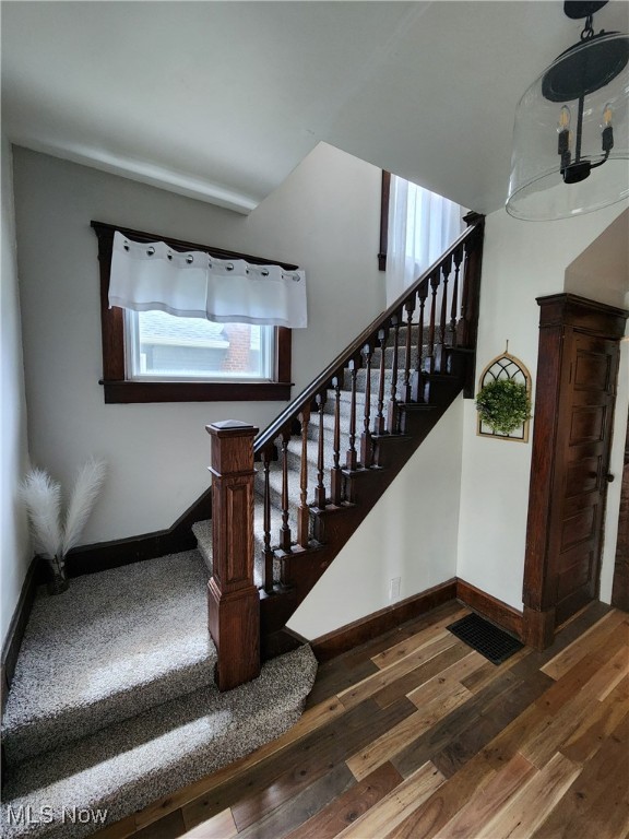 600 Orchard Ave, Cambridge, OH 43725 - staircase featuring baseboards and wood-type flooring