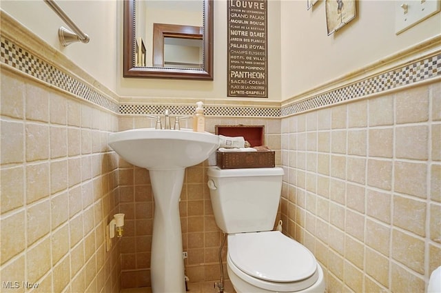 2925 Millboro Rd, Silver Lake, OH 44224 - half bath featuring tile walls and a wainscoted wall