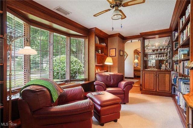 2925 Millboro Rd, Silver Lake, OH 44224 - living area with a ceiling fan, ornamental molding, arched walkways, and plenty of natural light