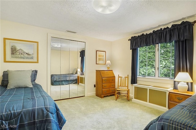 2925 Millboro Rd, Silver Lake, OH 44224 - bedroom featuring a textured ceiling, carpet floors, and a closet
