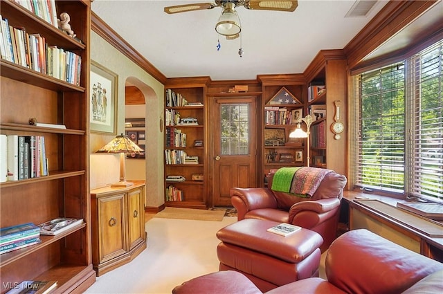 2925 Millboro Rd, Silver Lake, OH 44224 - living area featuring ceiling fan, ornamental molding, built in features, and arched walkways