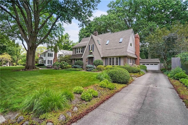 2925 Millboro Rd, Silver Lake, OH 44224 - view of front of home featuring a chimney, a garage, an outdoor structure, and roof with shingles