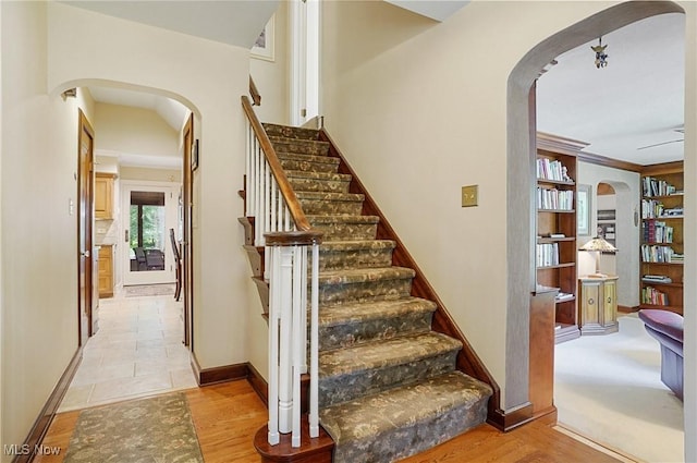 2925 Millboro Rd, Silver Lake, OH 44224 - staircase featuring arched walkways and baseboards