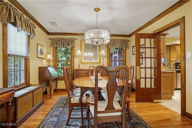 2925 Millboro Rd, Silver Lake, OH 44224 - dining area with light wood-style floors, a chandelier, and ornamental molding