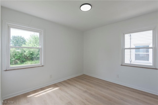 12800 Reindeer Ave, Garfield Heights, OH 44125 - spare room featuring light wood finished floors and baseboards