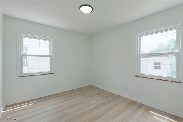 12800 Reindeer Ave, Garfield Heights, OH 44125 - unfurnished room with light wood-type flooring and baseboards