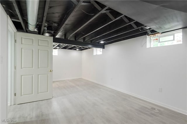 12800 Reindeer Ave, Garfield Heights, OH 44125 - basement with wood finished floors and baseboards