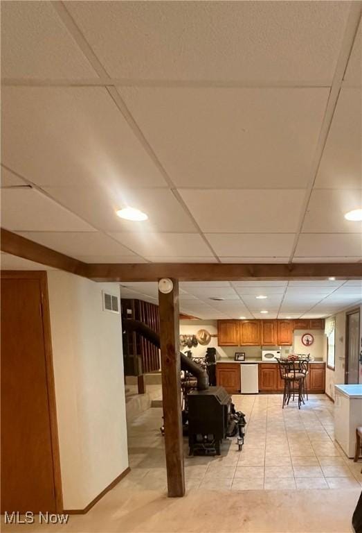 1321 Congo Arroyo Rd, New Cumberland, WV 26047 - finished basement featuring bar, a drop ceiling, and light tile patterned floors