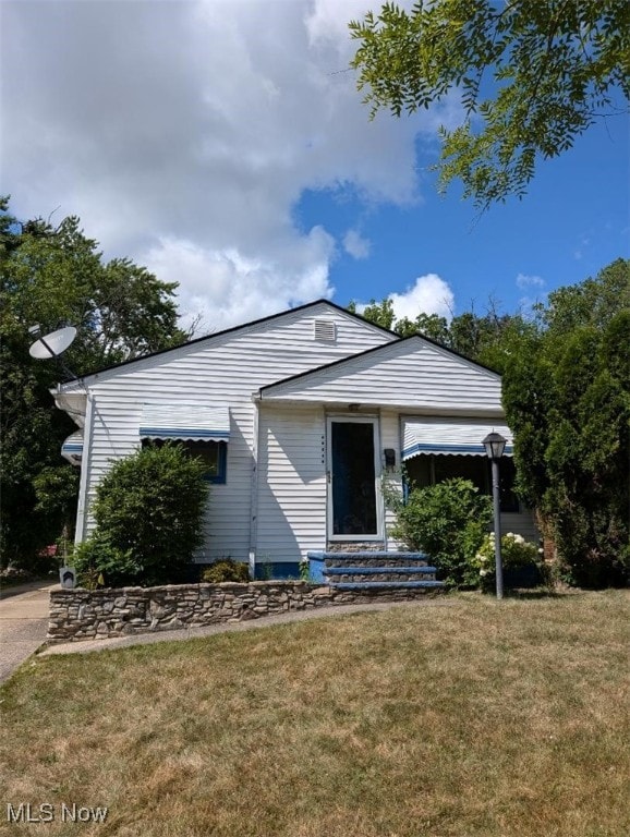 17005 Lipton Ave, Cleveland, OH 44128 - view of front of home featuring a front yard