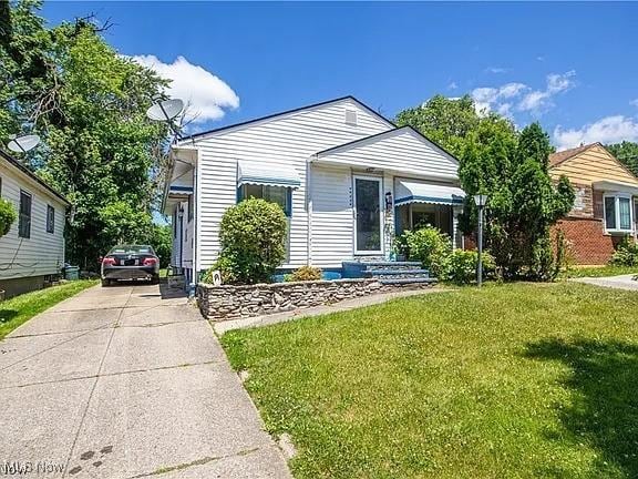 17005 Lipton Ave, Cleveland, OH 44128 - view of front facade with a front lawn and driveway