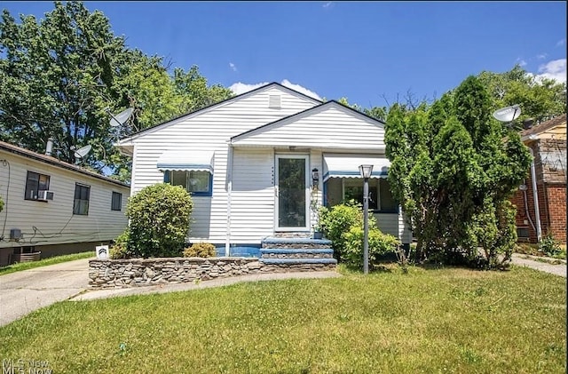 17005 Lipton Ave, Cleveland, OH 44128 - view of front of house with a front lawn