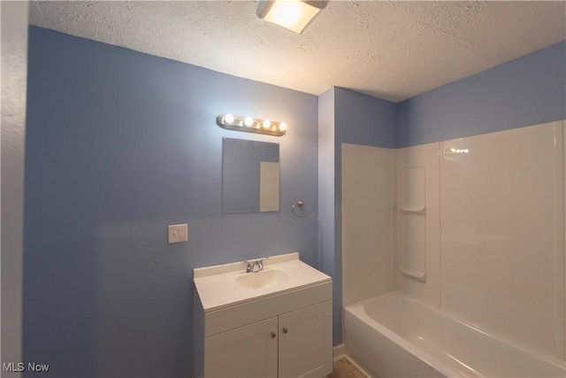 1022 Big Falls Ave, Akron, OH 44310 - bathroom with a textured ceiling, vanity, and shower / bathtub combination