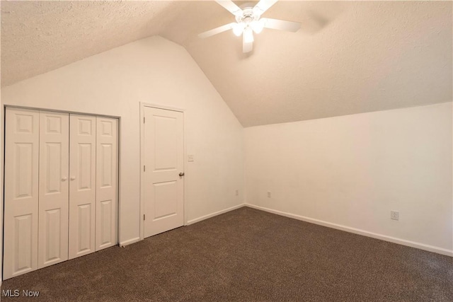 1022 Big Falls Ave, Akron, OH 44310 - bonus room with vaulted ceiling, ceiling fan, dark colored carpet, and a textured ceiling