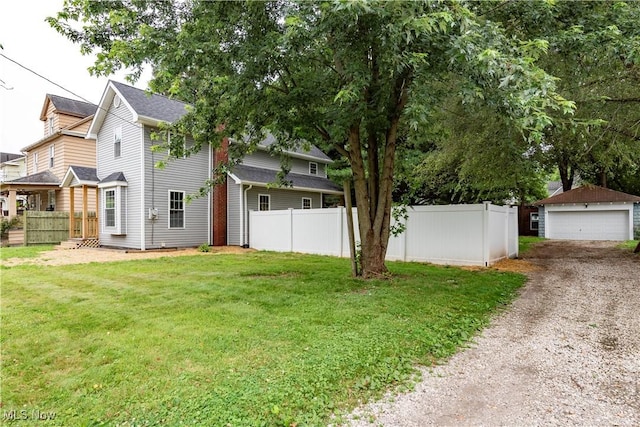 1022 Big Falls Ave, Akron, OH 44310 - view of yard with a detached garage and an outbuilding