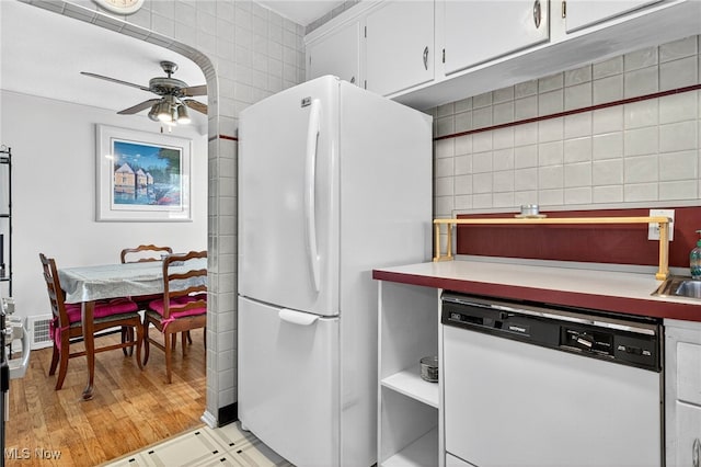 4095 W 161st St, Cleveland, OH 44135 - kitchen featuring white appliances, a ceiling fan, white cabinetry, light countertops, and tile walls