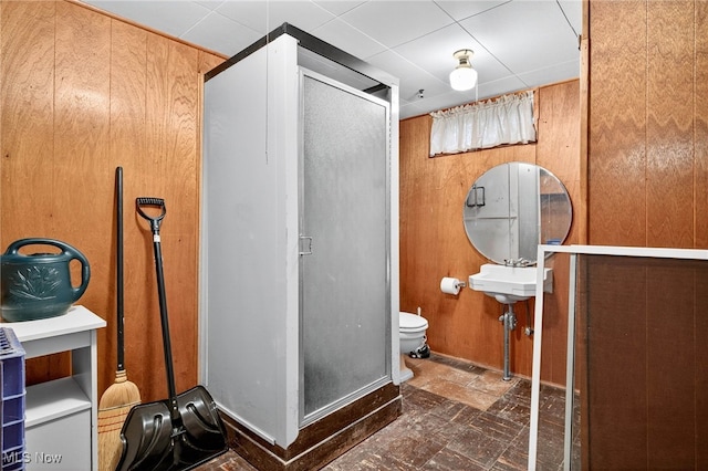 4095 W 161st St, Cleveland, OH 44135 - bathroom with a stall shower, stone finish flooring, and wooden walls