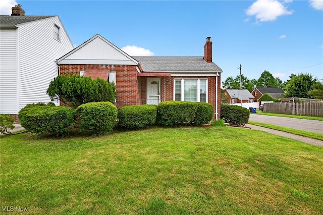 4095 W 161st St, Cleveland, OH 44135 - view of front facade featuring brick siding and a chimney