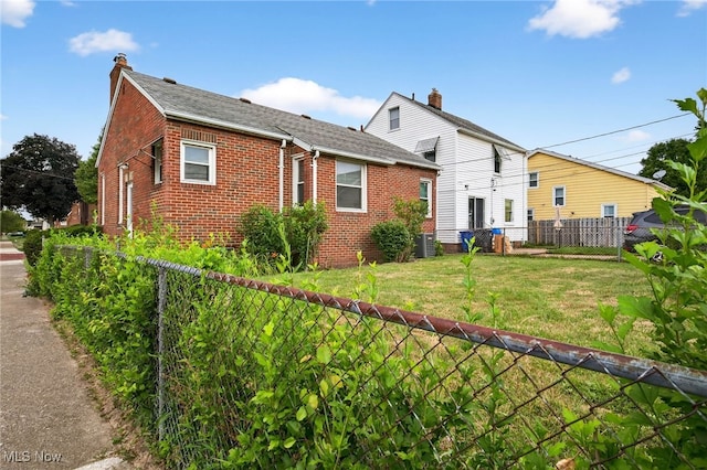 4095 W 161st St, Cleveland, OH 44135 - view of side of home featuring brick siding, a chimney, and roof with shingles