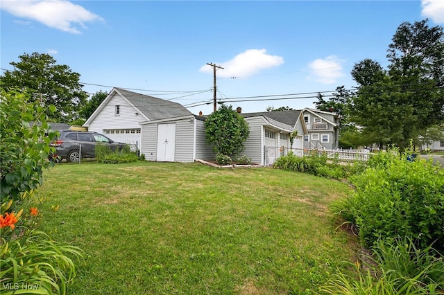 4095 W 161st St, Cleveland, OH 44135 - view of yard with a detached garage and a storage shed