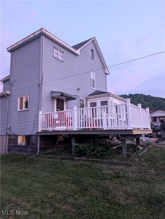 331 Louisiana Ave, Chester, WV 26034 - rear view of property with a wooden deck and a lawn