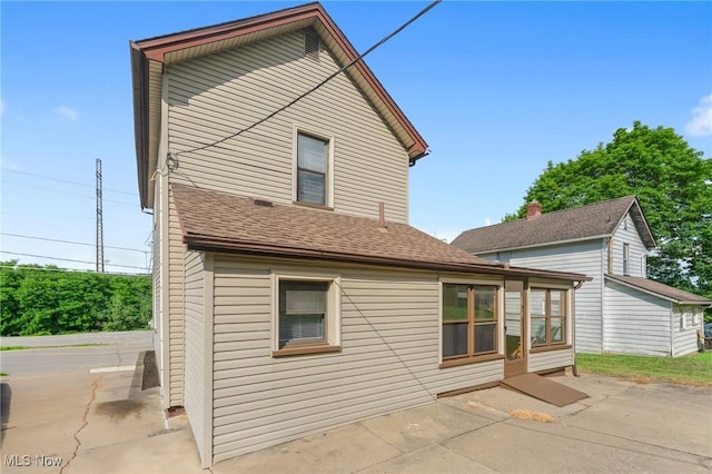 160 State St, Struthers, OH 44471 - rear view of house featuring a patio and a shingled roof