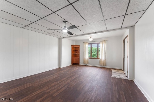 160 State St, Struthers, OH 44471 - unfurnished room featuring a ceiling fan, dark wood-style floors, and a paneled ceiling
