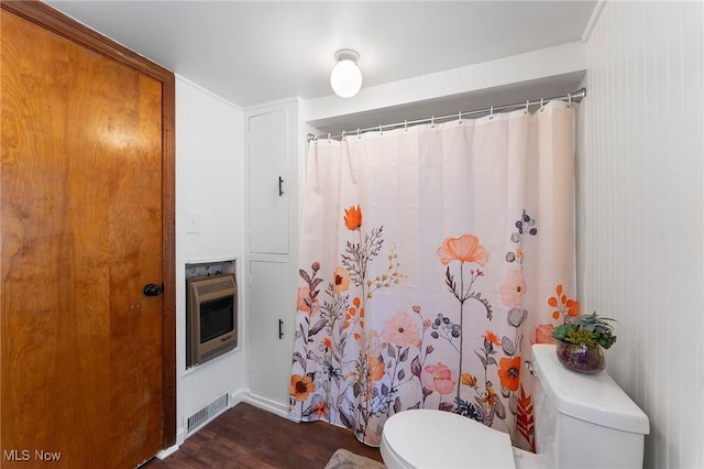 160 State St, Struthers, OH 44471 - full bathroom with heating unit, wood finished floors, and curtained shower