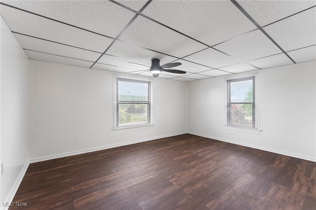 160 State St, Struthers, OH 44471 - empty room with plenty of natural light, wood finished floors, and a paneled ceiling