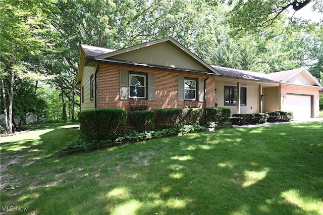 755 Blueberry Hill Dr, Canfield, OH 44406 - single story home featuring brick siding, a garage, and a front lawn