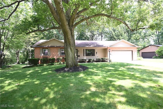 755 Blueberry Hill Dr, Canfield, OH 44406 - ranch-style house with a garage, a front lawn, and brick siding