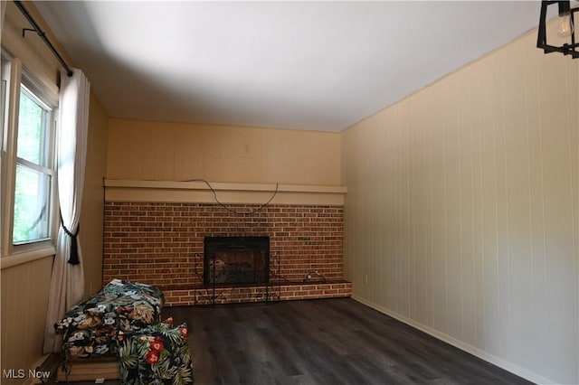 755 Blueberry Hill Dr, Canfield, OH 44406 - unfurnished living room featuring a fireplace, wood finished floors, and wood walls