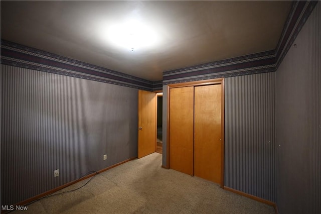 755 Blueberry Hill Dr, Canfield, OH 44406 - unfurnished bedroom with wallpapered walls, carpet flooring, and a closet