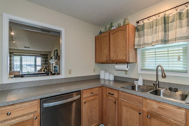 3886 Dugans Lndg, Perry, OH 44081 - kitchen featuring dishwasher, dark countertops, and brown cabinets