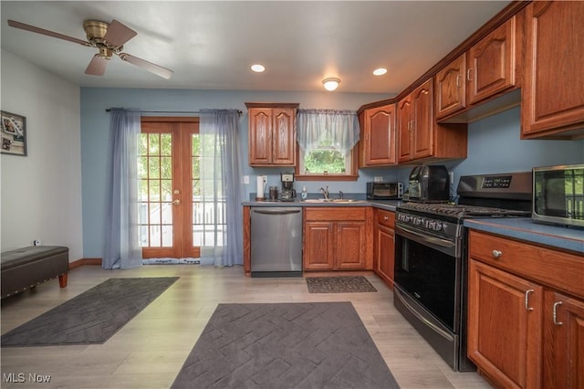 440 Lyons Ave, East Palestine, OH 44413 - kitchen featuring stainless steel appliances, healthy amount of natural light, recessed lighting, a ceiling fan, and brown cabinetry