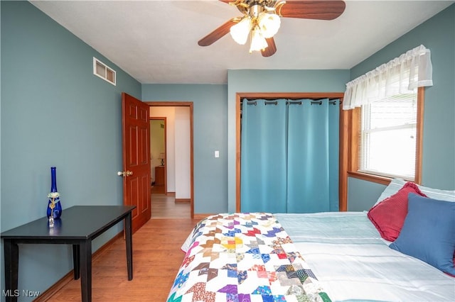 440 Lyons Ave, East Palestine, OH 44413 - bedroom with wood finished floors, a closet, and a ceiling fan