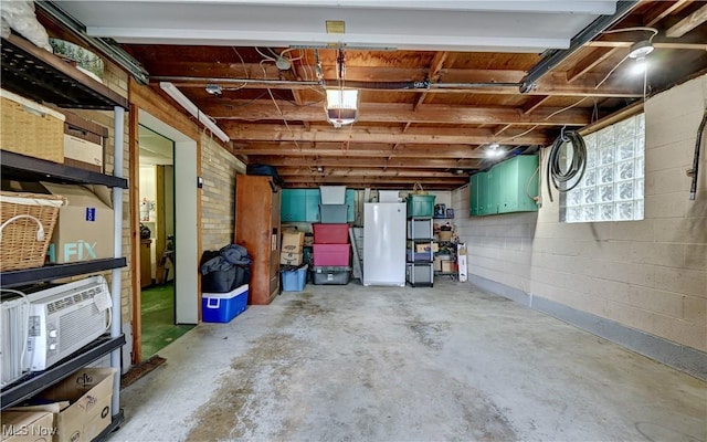 2463 NW Renner Dr NW, Dover, OH 44622 - garage featuring fridge and a garage door opener